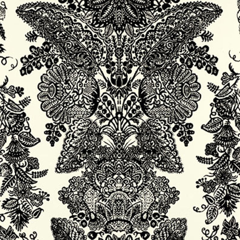 Intricate black damask floral pattern on cream backdrop; ornate symmetrical textile or wallpaper print.