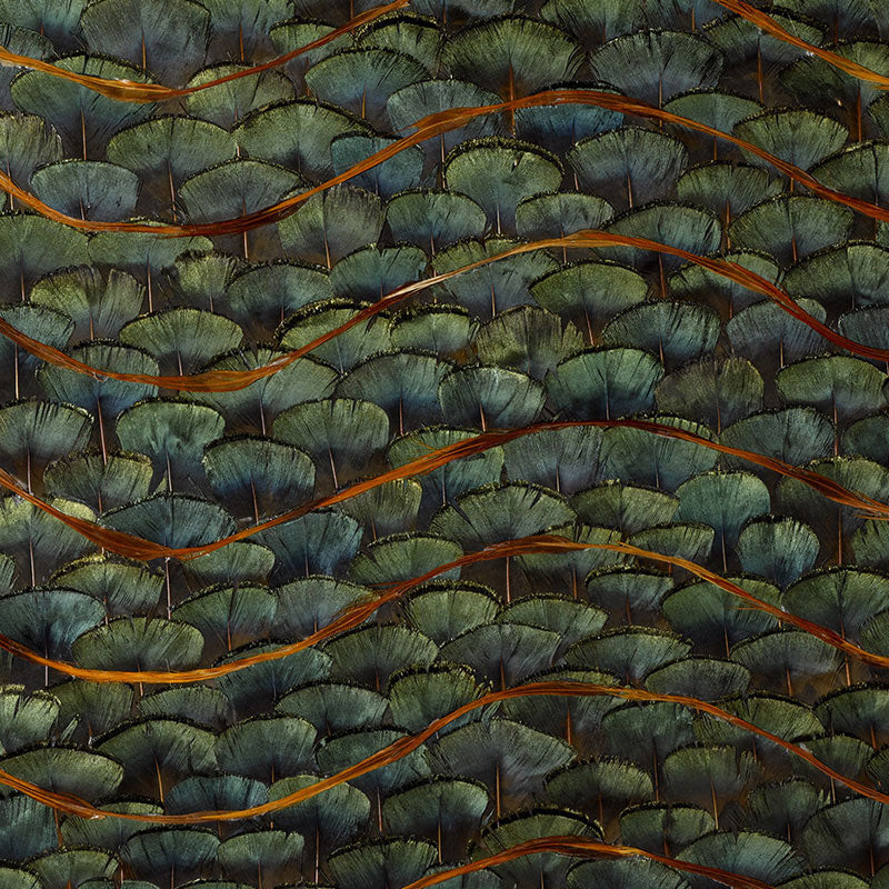 Close-up fabric pattern of teal-green scalloped leaves with orange-brown wavy lines.