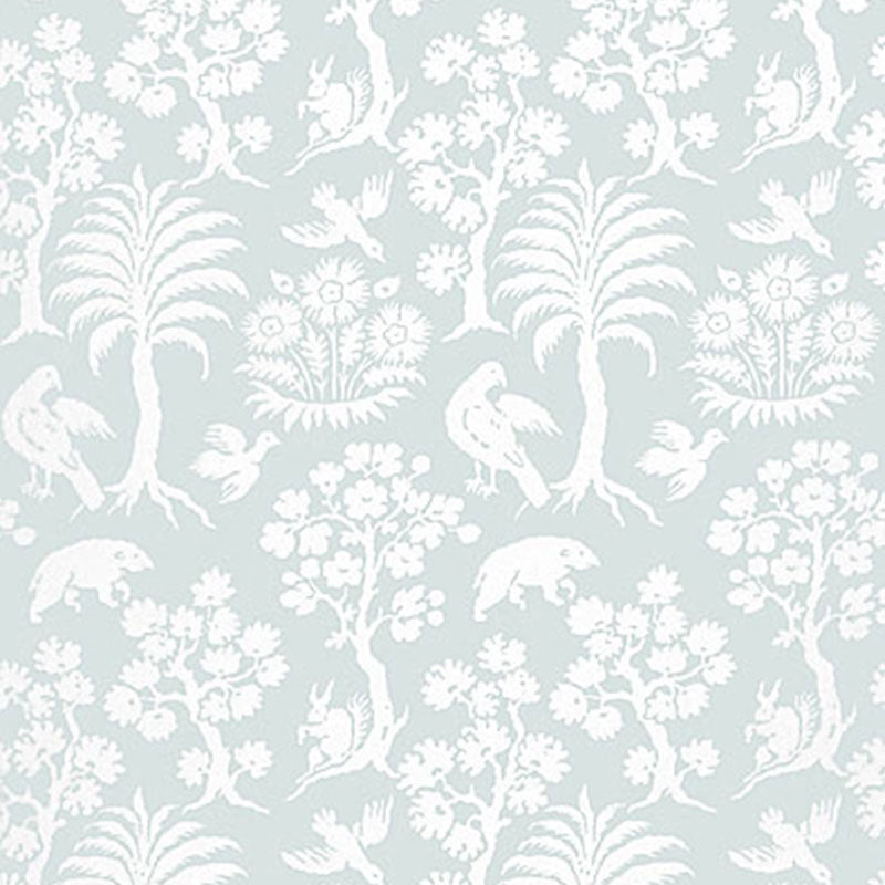 Light blue wallpaper with white silhouettes of birds, palm trees and blossoms in a toile-style pattern.