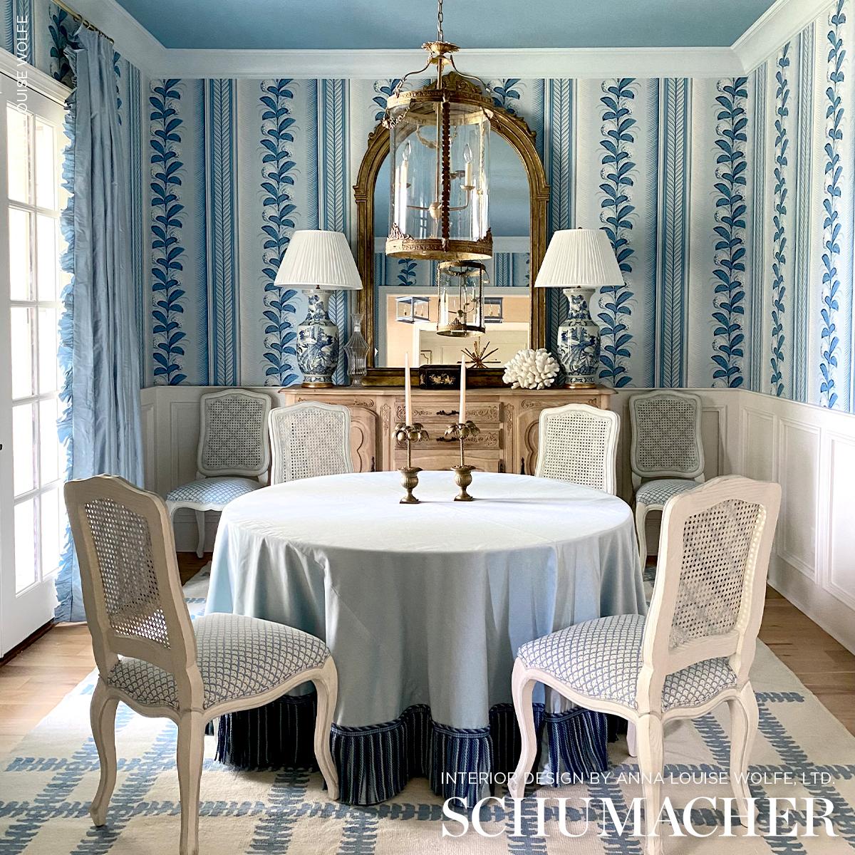 Schumacher Hydrangea Drape Wallpaper in Delft featuring large-scale hydrangea floral stripe design with ornate border in soft blue tones. Luxury designer wallpaper ideal for elegant interiors, dining rooms, bedrooms, hallways, powder rooms, and statement accent walls inspired by classic Hollywood decor.