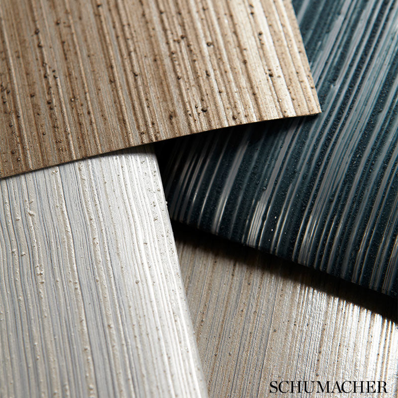 Faux metallic strie panels with a silvered taupe finish and vertical grooves.