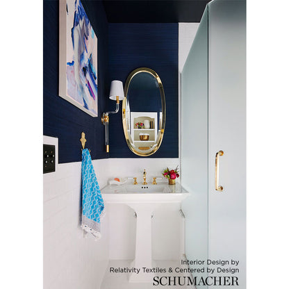 Wall covered with ultramarine bamboo-pattern wallpaper.