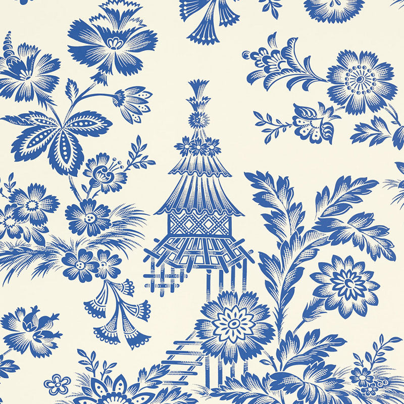 Cobalt blue chinoiserie floral pattern on ivory wallpaper, featuring a pagoda lantern and blooming flowers.