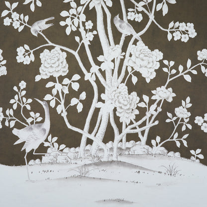Chinoiserie-style white floral and bird wallpaper on dark brown background.