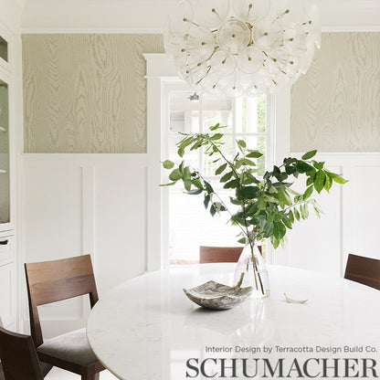 Wallpaper with a faux bois wood-grain pattern in silver-gray tones.