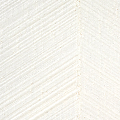 Close-up of ivory textured wallcovering with a combed chevron pattern and diagonal brushed texture.