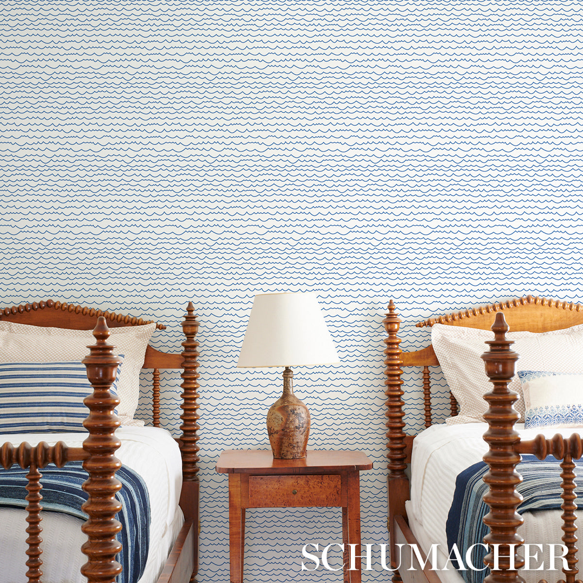 Blue wallpaper with a wavy pattern.
