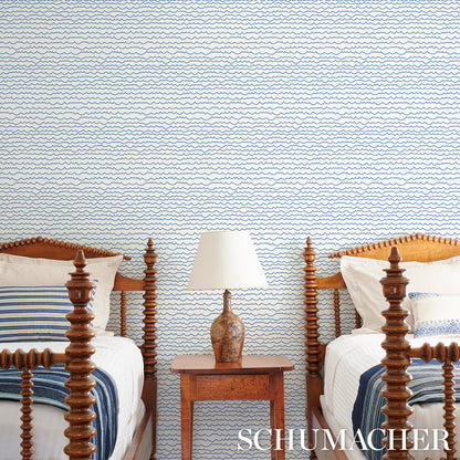 Blue wallpaper with a wavy pattern.