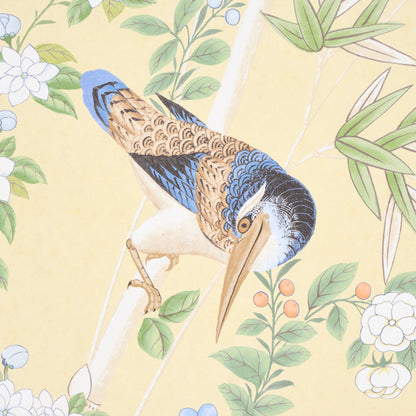 Illustrated kingfisher with blue and brown plumage perched on a branch amid green leaves and white flowers.