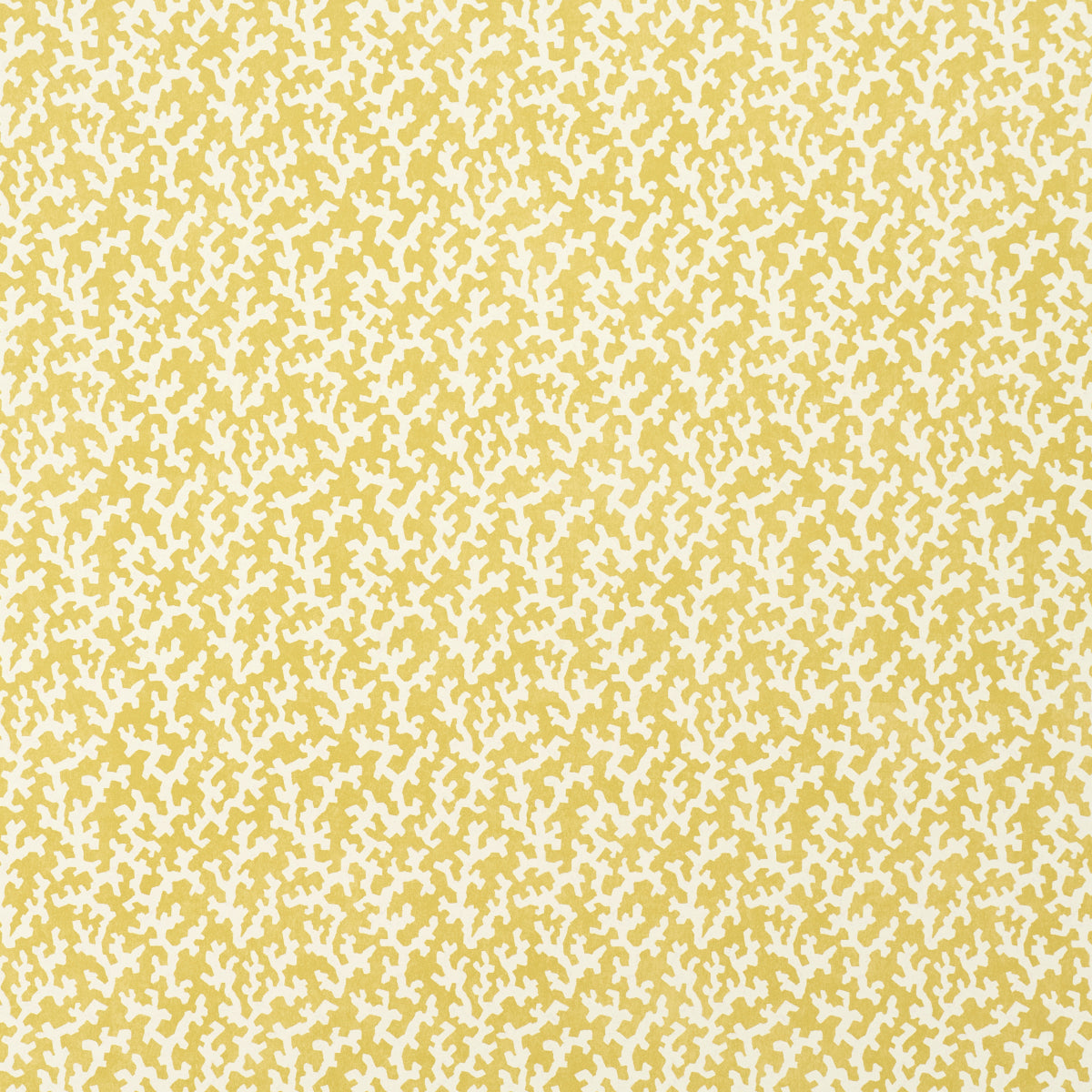 Mustard-yellow fabric with an irregular white speckle confetti-like pattern; abstract textile texture.