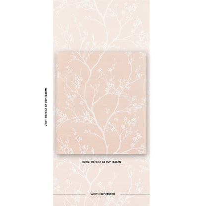 Peach-colored notebook with white botanical tree-branch pattern, shown in a matching decorative sleeve.