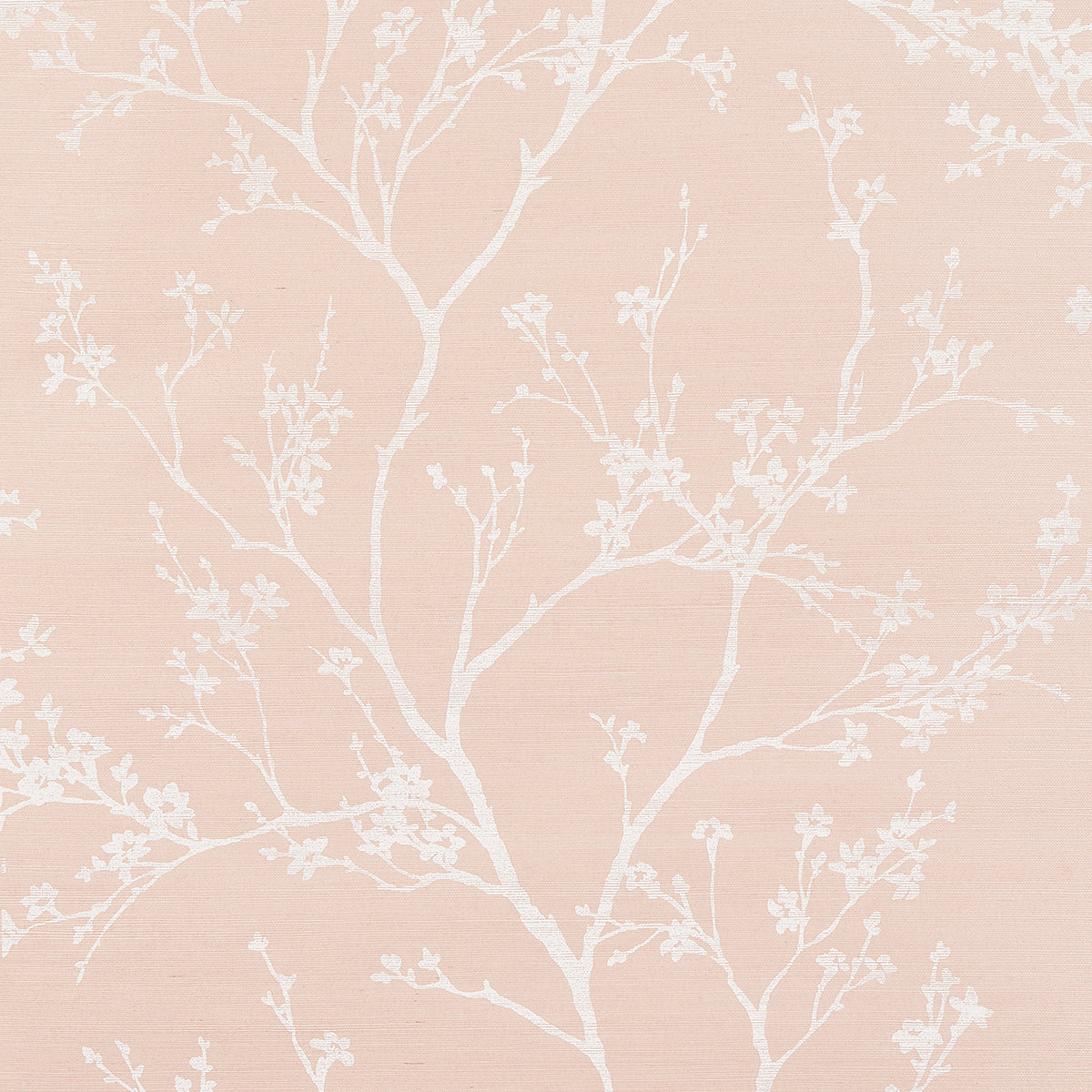 Peach pink wallpaper with white delicate tree branches and blossom pattern.