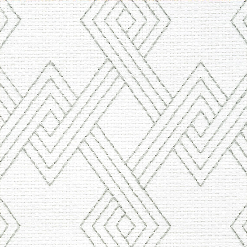 White fabric with stitched silver-gray diamond geometric pattern, modern decorative textile.