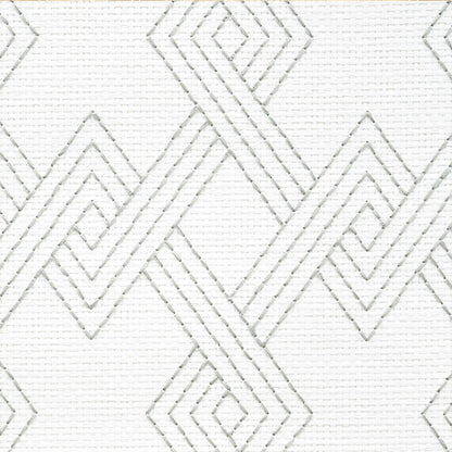 White fabric with stitched silver-gray diamond geometric pattern, modern decorative textile.