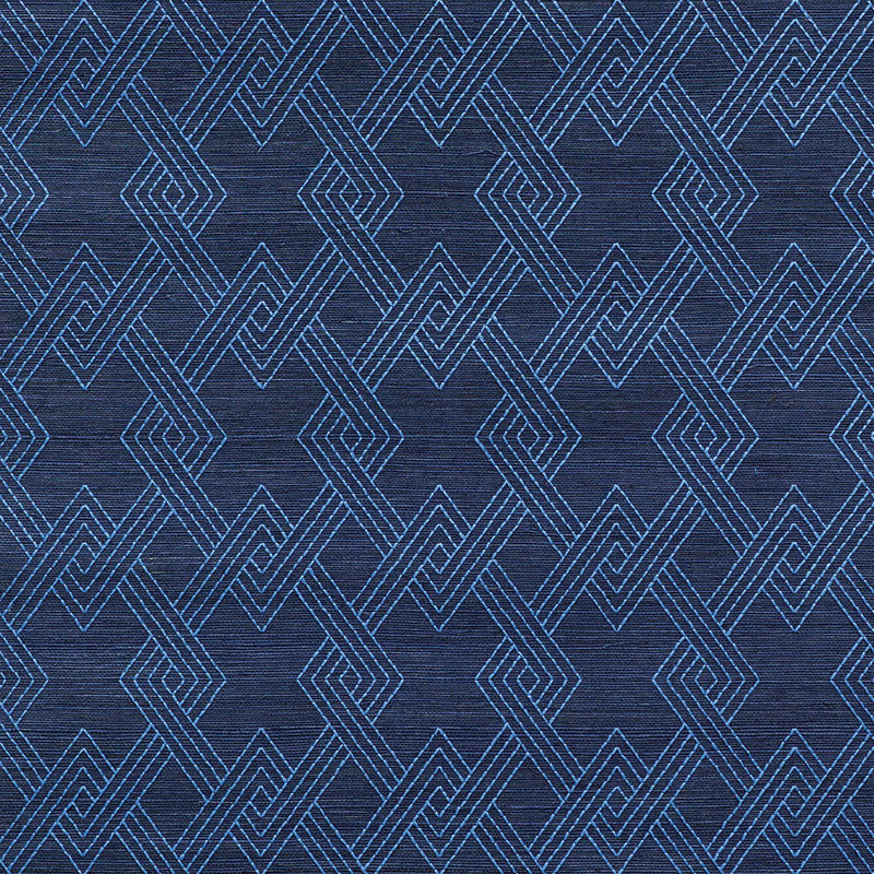 Dark blue woven fabric with interlocking light-blue diamond geometric pattern; decorative textile or rug design.