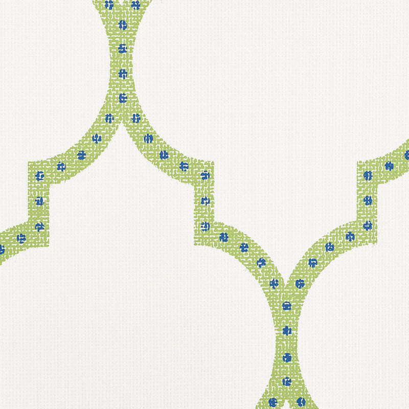 Beige fabric with lime-green interlocking curved lattice motifs outlined by stitched lines and tiny blue flowers.