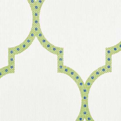 Beige fabric with lime-green interlocking curved lattice motifs outlined by stitched lines and tiny blue flowers.
