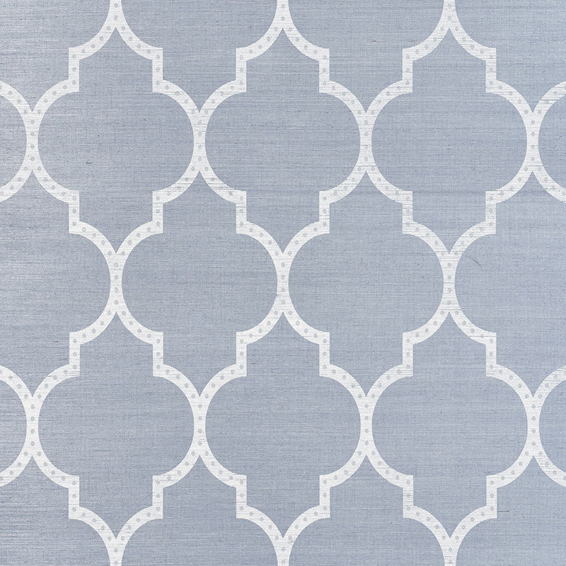 Blue-gray fabric texture with white repeating quatrefoil lattice pattern.