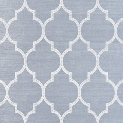 Blue-gray fabric texture with white repeating quatrefoil lattice pattern.