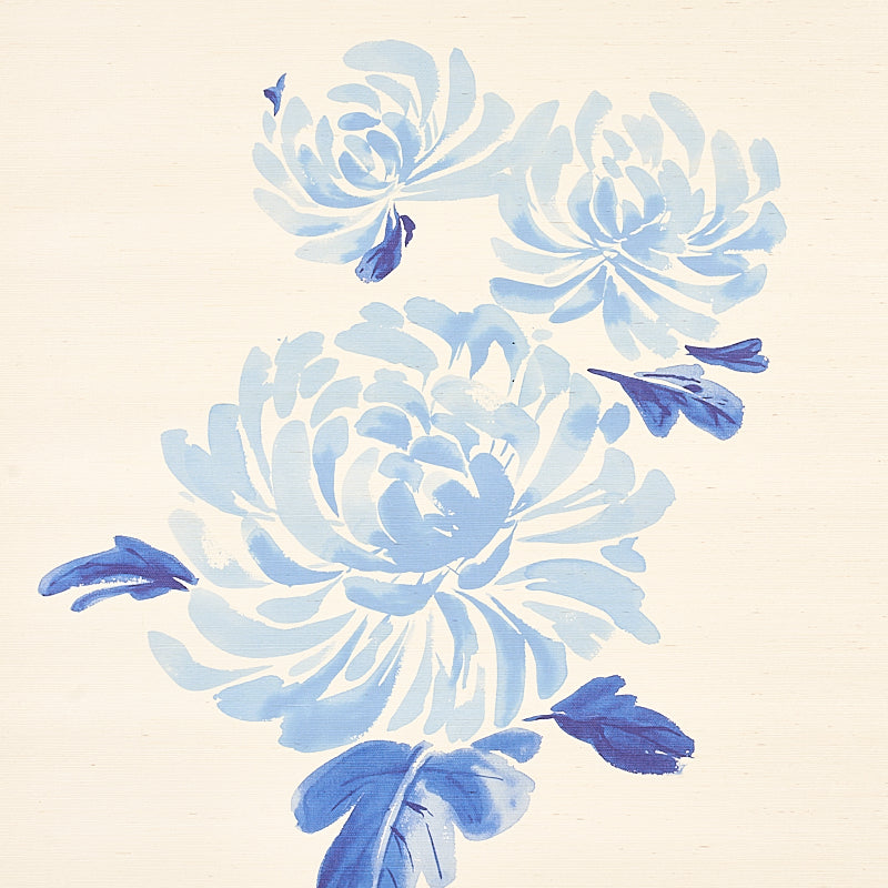 Beige background sisal rug with large pale blue chrysanthemum blooms & scattered dark blue petals, modern floral print.