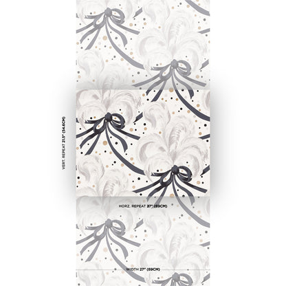 Vertical wallpaper panel with pale ivory background, grey floral motifs and dark navy ribbon bows with gold specks.