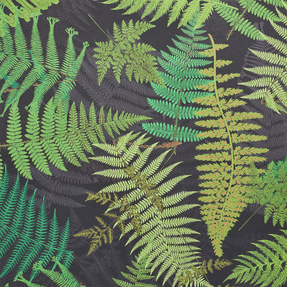 Dark fabric with layered green fern leaves; tropical botanical print for clothing or decor.
