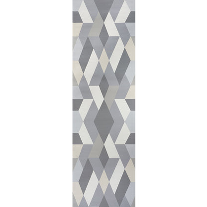 Geometric rug with stacked gray, blue and beige chevron/diamond triangles in a modern abstract pattern.