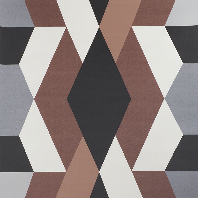 Geometric diamond-pattern rug in black, gray, white, taupe and brown tones; mid-century modern.