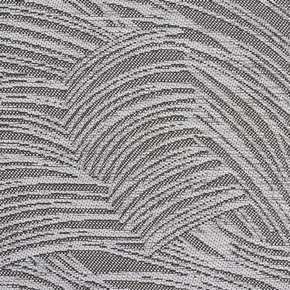 Gray and black wallpaper with a textured, wavy palm-leaf pattern.