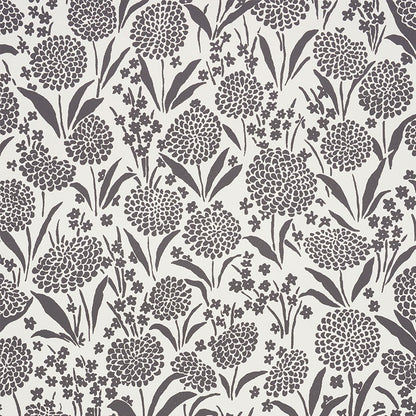 Dark purple floral pattern with round pom-pom blossoms, long leaves and tiny flowers on a cream background; a textile print.