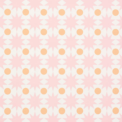 Repeating geometric pattern of soft pink starbursts and peach circles, retro textile/wallpaper design.
