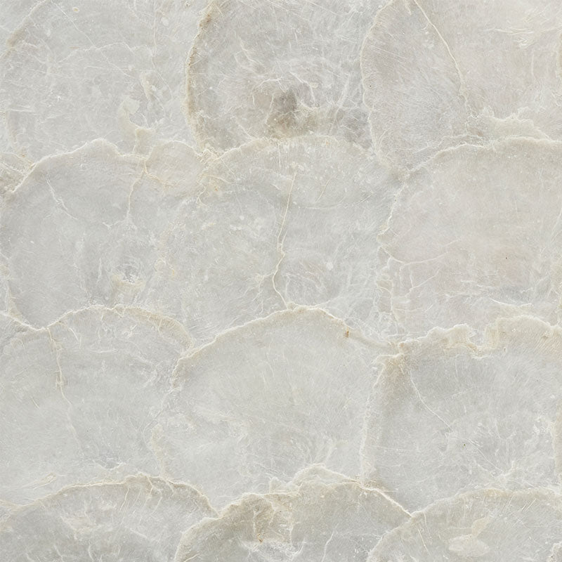 Light gray marble tile with delicate cream veining, ideal for countertops or flooring.