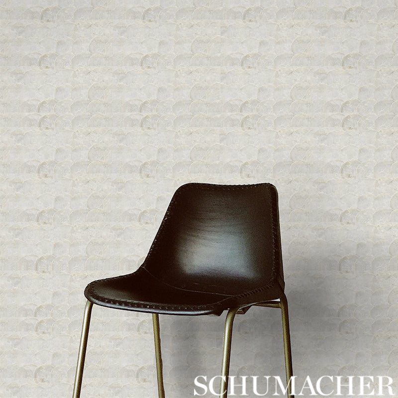 Abalone Pearl dining chair with a curved back and brass-tone metal legs, mid-century modern style.
