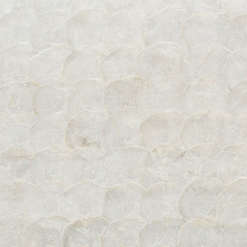 Cream textured plaster-like surface with subtle overlapping circular pattern; neutral wall finish.