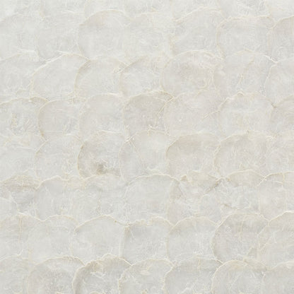 Cream textured plaster-like surface with subtle overlapping circular pattern; neutral wall finish.