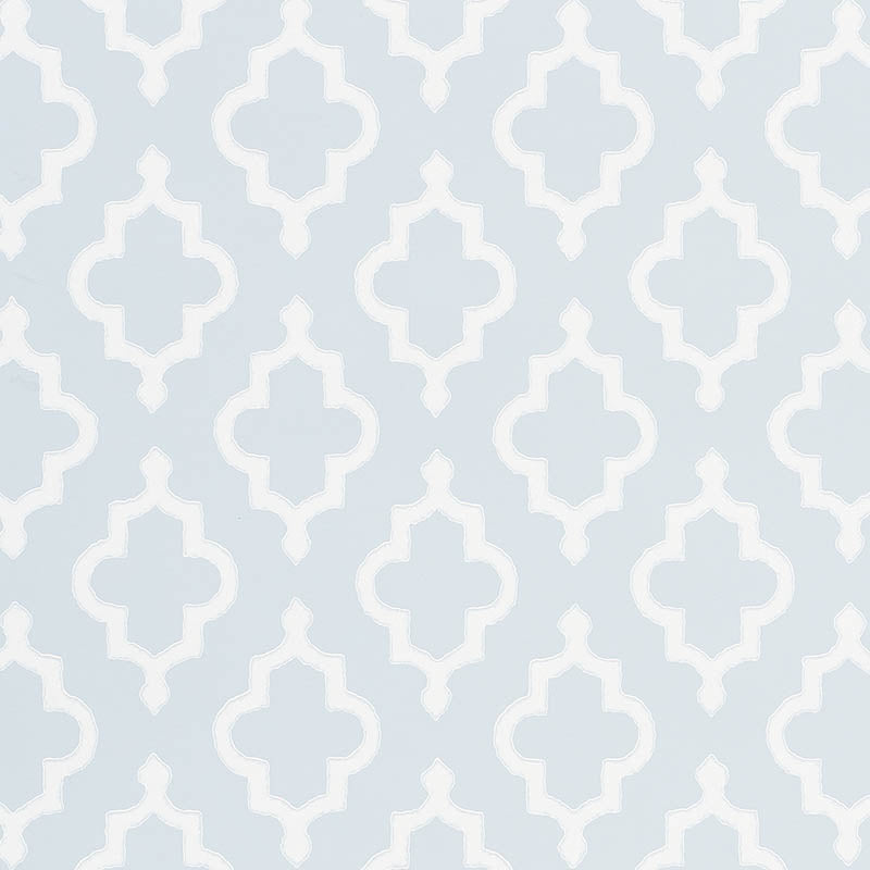 Light blue wallpaper with a white quatrefoil lattice pattern.
