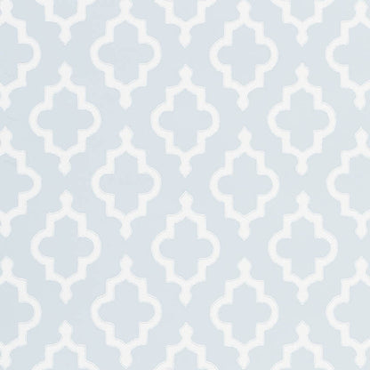Light blue wallpaper with a white quatrefoil lattice pattern.