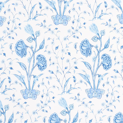 Blue floral pattern with tall stems and blossoms on white porcelain.