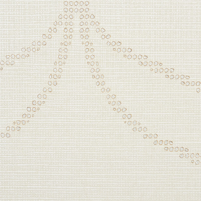 Beige textured fabric with cream bead embroidery forming diagonal dotted lines radiating from a central point.