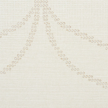 Beige textured fabric with cream bead embroidery forming diagonal dotted lines radiating from a central point.