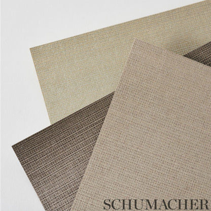 Overlapping beige, taupe and brown linen-textured fabric swatches.