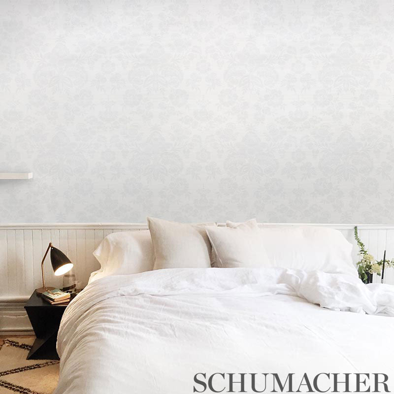 Silver damask grasscloth wallpaper on a wall
