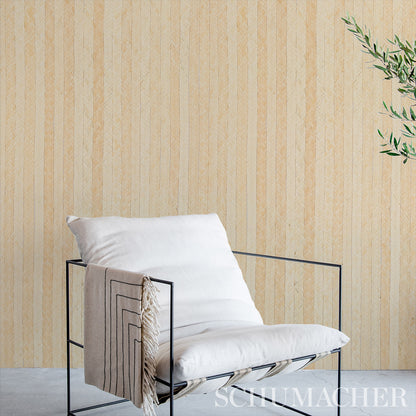 Natural textured grasscloth wallcovering with braided burl pattern; plant visible in corner.