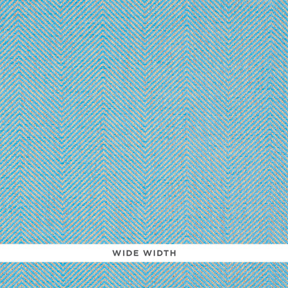 Sky blue herringbone textured wallcovering with cream accents; wide width label visible.