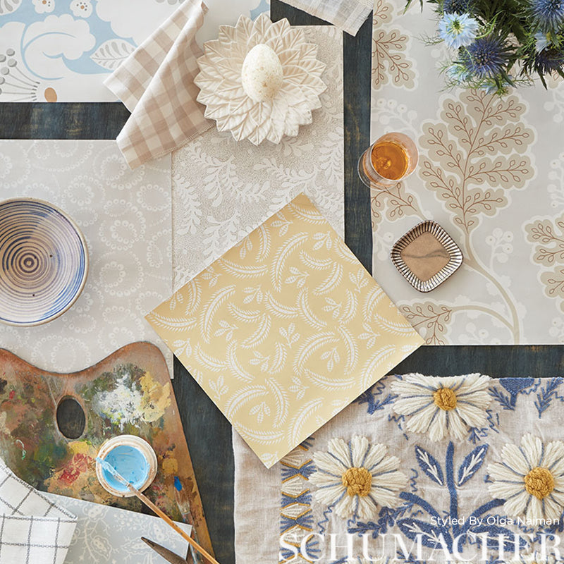 Fabric swatch with a yellow floral pattern.