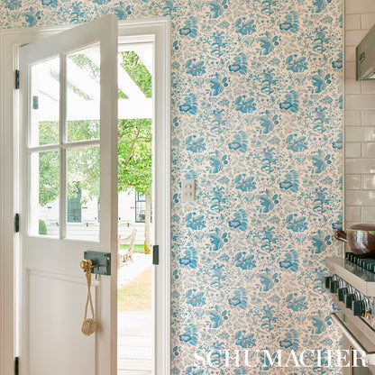 Citron-colored wallpaper with a pomegranate botanical pattern.