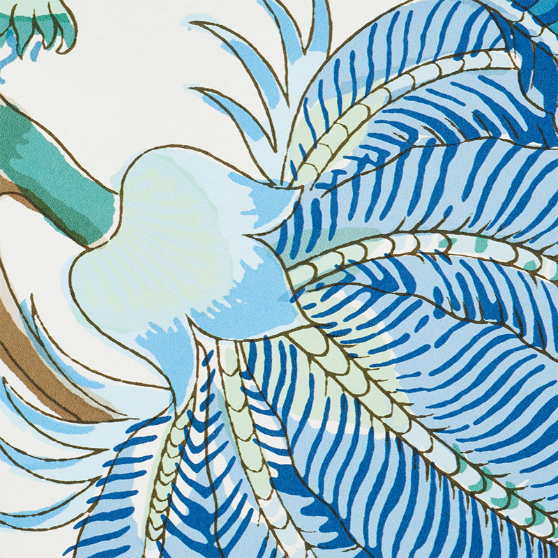 Abstract tropical print with bold blue striped palm leaves, teal accents and beige rope-like strands.