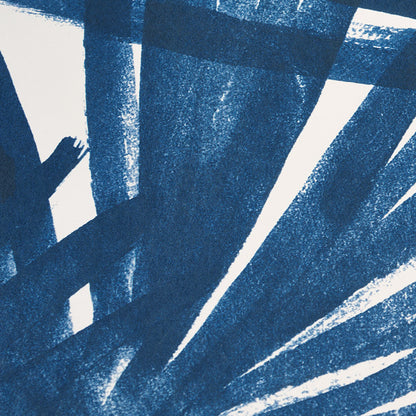 Blue palm leaf pattern with a tropical sunlit motif on a pale background.