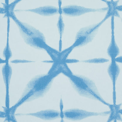 Light blue fabric with darker blue tie-dye geometric X motif, soft casual textile for apparel or home decor.