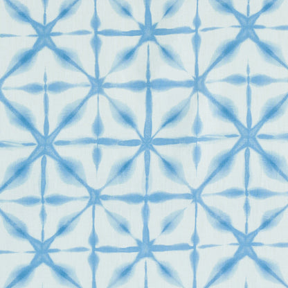 Blue tie-dye geometric lattice fabric print with starburst diamond shapes on white background.